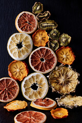 Exotic, tropical and citrus dried fruits in shape of pyramid.