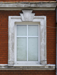 Fototapeta na wymiar old window on a brick wall