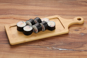 sushi on a wooden board