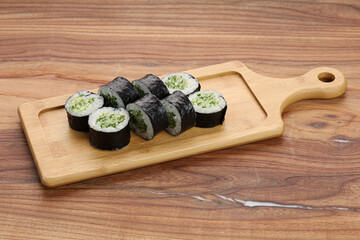 sushi on a wooden board