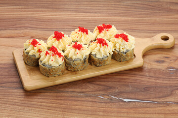 sushi on a wooden board