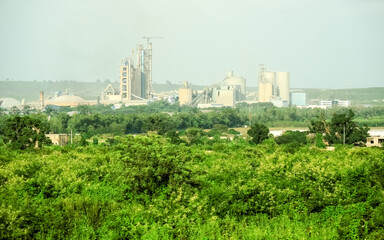 Fototapeta na wymiar cement industry surrounded by vegetation in the African country of Senegal