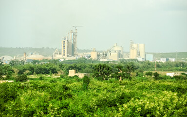 Fototapeta na wymiar cement industry surrounded by vegetation in the African country of Senegal