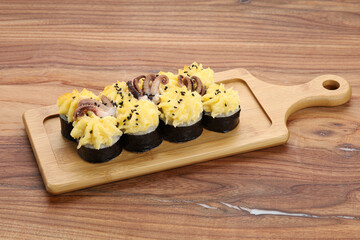 sushi on a wooden board
