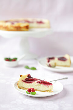 Cheesecake with raspberries on the plate