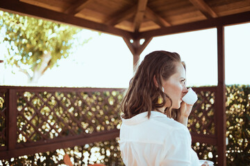 relaxed stylish woman in white shirt