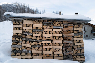 dry chopped fire wood in alp mountain