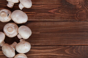 fresh champignons close-up on a wooden table Vegetarian food. Proper nutrition