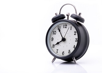 Naklejka premium Black alarm clock ta against white background.