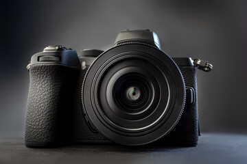 Fototapeta digital camera on a dark background obraz