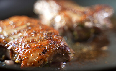 Duck fillet is cooked in a pan.