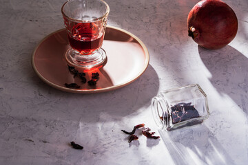 Refreshing fruit herbal tea in glasses, hard light with harsh shadows