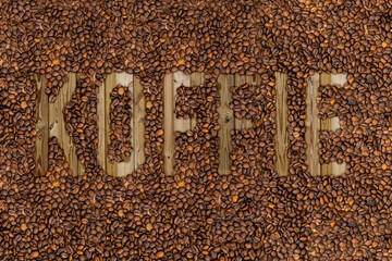 coffee lettering with grains seed beans in different languages dutch