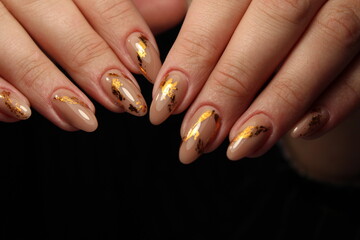 glamorous beautiful manicure on a trendy texture