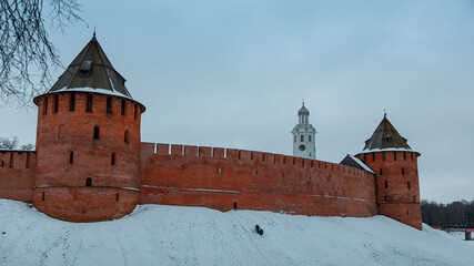 Red brick castle. Novgorod Kremlin. A cold winter evening. An ancient structure.