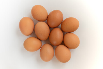 Group brown fresh eggs, isolated on white background.