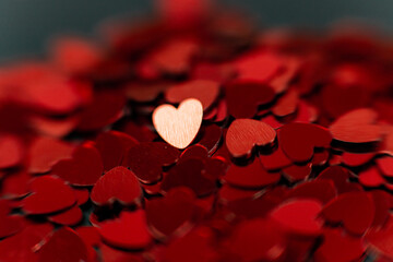 Scattering of small red hearts, beautiful background of hearts for the holiday of valentine