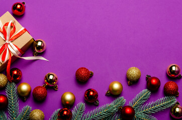 Lilac background with pink and lilac christmas balls and flat lay.blur