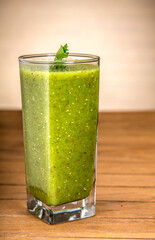 Green juice on wooden board