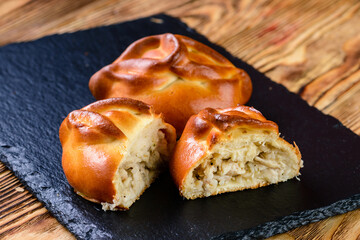russian homemade hearty pies with different fillings. Homemade baking. Traditional Russian and...