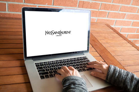 Yves Saint Laurent logo on macbook screen