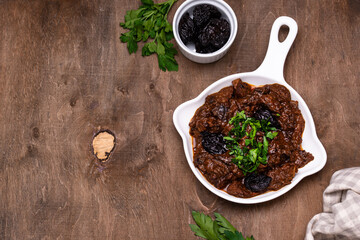 Hot stewed meat with prunes