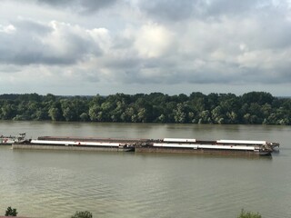 Scenic landscape of oil tanker transport crossing the Danube river  