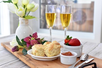 Celebratory Mother's Day brunch for breakfast in bed to honour Mom with gourmet scones and preserves and champagne. 