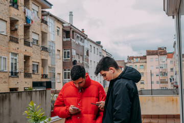 young people with mobile phone in the city