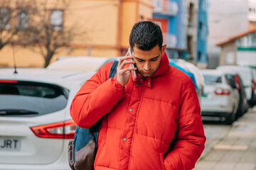 young man using smartphone on the street