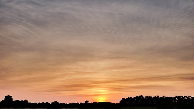 Beautiful sunset sky over the clouds