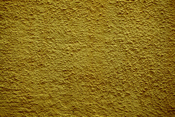 Rough dingy brown wall background texture with stippled effect to the surface in a full frame view. This is a lighter version, a darker version is also available in the portfolio