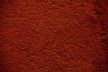 Background texture of a rough finish concrete wall painted in a red brown color in a full frame view. This is a lighter version, a darker version is also available in the portfolio