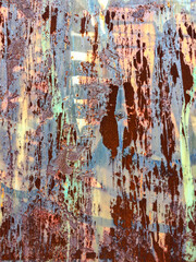 Rusty metal wall texture that forms a collage with old, torn, scratched 