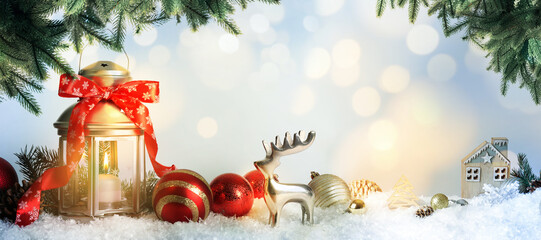 Beautiful composition with vintage Christmas lantern and festive decorations on snow against color background, banner design. Bokeh effect