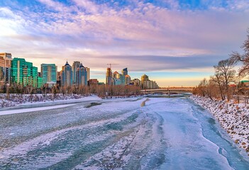 Cloudy Sunrise Over A Frozen Calgary River Valley