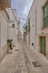 Typical Street Scene Of The Historical Center of Martina Franca, A Village In Puglia, Apulia, Italy On A Cloudy Rainy Day