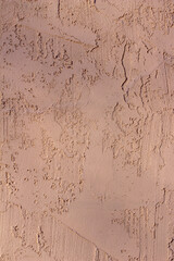 Obraz premium Full frame texture background of a vintage reddish brown stucco wall with attractive texture and faint tree shadows