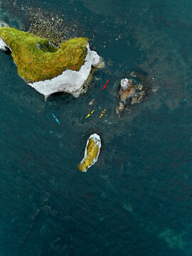 Aerial view of kayaks near Old Harry Rocks in Studland, Dorset, United Kingdom.