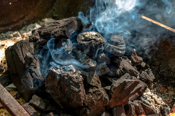 Burnt lumps of charcoal for bbq