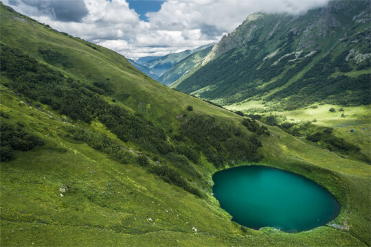 Aerial view of little lake in the mountains of Caucasus Nature Reserve, Russia