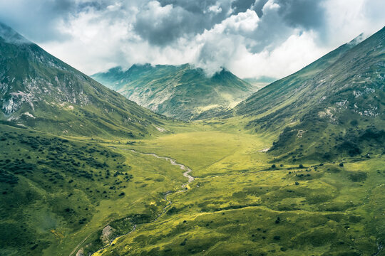 Aerial view of valley between mountains of Caucasus nature Reserve, Russia - Powered by Adobe