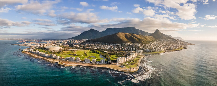 Panoramic aerial view of Lion’s Head, Green Point Stadium, Table Mountain and Mouille Point Lighthouse in summer from Atlantic Seaboard Sea Point Cape Town, South Africa