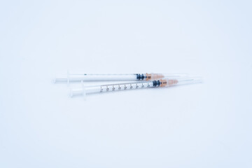 Obraz premium two medical syringes on white background
