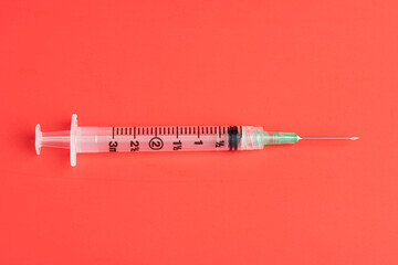 Hygienic Single-Use Disposable Injection On Red Background