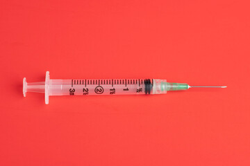 Hygienic Single-Use Disposable Injection On Red Background