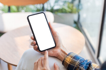 cell phone blank white screen mockup.woman hand holding texting using mobile on desk at office.background empty space for advertise.work people contact marketing business,technology