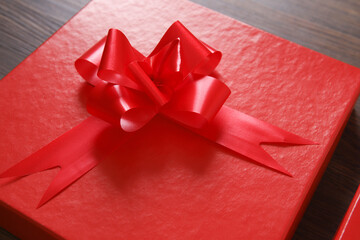 red gift boxes on wooden background with space
