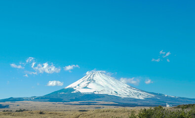 Fototapeta premium View of Mount Fuji in the distance from Yamanashi Prefecture on a clear day.