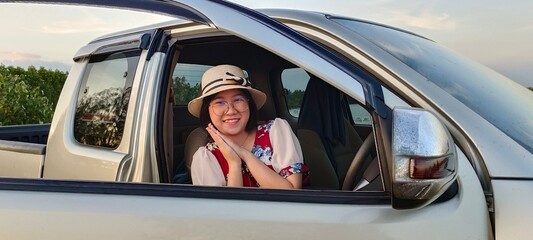 Young woman enjoy life in car of holiday travel vacation.